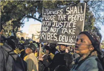  ?? Photo: Wikus De WET/AFP ?? Solidarity: Supporters of Jacob Zuma, the former South African president, listen to him speak following his appearance at the Zondo commission in Johannesbu­rg on July 15, 2019.