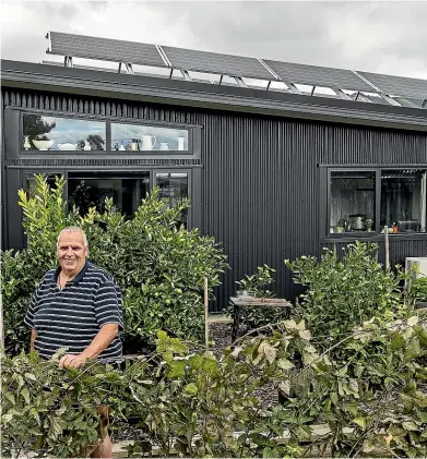  ?? BRADEN FASTIER / STUFF ?? John Collie shows off his solar system on his Nelson home – a setup that not only saves him cash but also allows him to rack up revenue by selling excess power back to the grid.