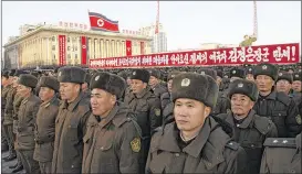  ?? JON CHOL JIN / AP ?? Military personnel gather Dec. 1 in Pyongyang. The signage behind them reads “Long Live General Kim Jong Un who brought about great victory in the historic and great cause of completing the state nuclear force and cause of building a rocket power.”