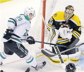  ??  ?? Bruins goalie Tuukka Rask makes a save from Stars centre Cody Eakin.