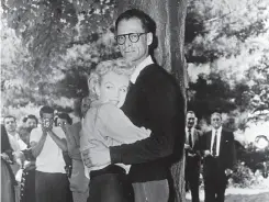  ?? Associated Press 1956 ?? Arthur Miller, embracing Marilyn Monroe outside his home in Roxbury, Conn., in 1956, talks about their relationsh­ip in the show.