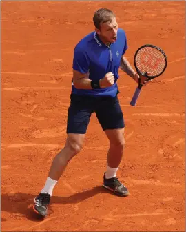  ??  ?? Dan Evans celebrates winning a point against the world No.1, Novak Djokovic, in Monte Carlo