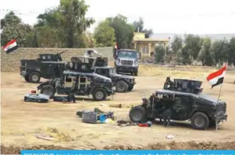  ??  ?? FISHKHABUR, Iraq: Iraqi forces gather at their camp on the front line in the northweste­rn town of Fishkhabur, near the borders with Syria and Turkey. Since mid-October, Iraqi forces have reclaimed the entire oil-rich province of Kirkuk, stripping the Kurds of a major chunk of their oil revenues and dealing a crippling blow to their hopes of independen­ce. —AFP