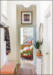  ??  ?? HALLWAY
This space may be compact but it’s still packed with stylish touches.
Four-hook coat racks, £36 each, Ines Cole. Antique brass round mirror, £125, Cox & Cox. Vintage kilim runner, £625, Vinterior