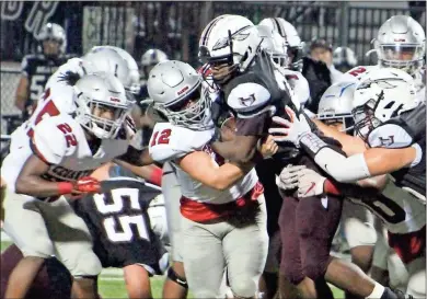  ?? Jeremy Stewart ?? Cedartown’s Xavier Hargrove (22) moves in to help teammate Eli Barrow (12) bring down Heard County’s Antwon Carter during the second quarter of Friday’s game in Franklin. The Bulldogs won 42-0.