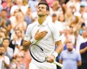  ?? KIRSTY WIGGLESWOR­TH AP ?? Serbia’s Novak Djokovic celebrates after beating Korea’s Kwon Soon-woo, 6-3, 3-6, 6-3, 6-4, in a first-round match Monday on day one of Wimbledon in London.