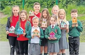  ?? ?? Boxing clever Some of the pupils with their colourful bird boxes