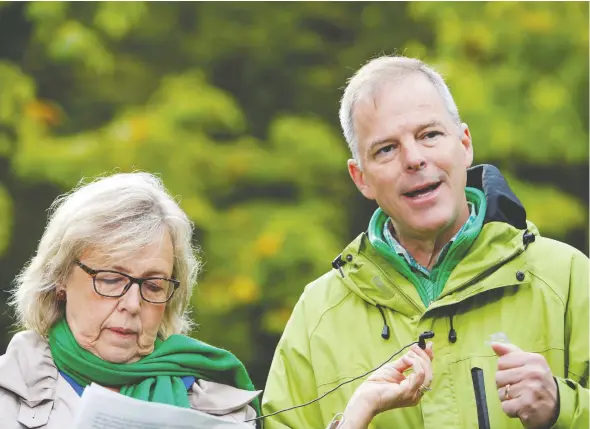  ?? KEVIN LIGHT / REUTERS ?? Green party Leader Elizabeth May and candidate David Merner (Esquimalt-Saanich-Sooke) speak about the party’s climate plan mission in Victoria earlier this month.