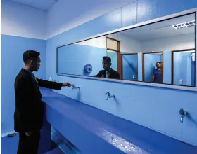  ?? ?? Teachers’ trainee Abdul Basir Muhamad inside the men’s toilet at IPG Raja Melewar Campus, which has just undergone upgrading and maintenanc­e works.