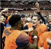  ?? ADRIAN KRAUS / ASSOCIATED PRESS ?? Last week’s big game by quarterbac­k Eric Dungey (right, with linebacker Zaire Franklin) in the upset of Clemson offers the Canes proof that Syracuse should not be taken lightly.