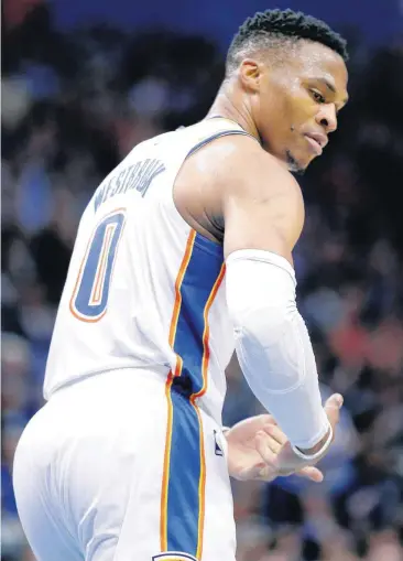  ?? [PHOTO BY SARAH PHIPPS, THE OKLAHOMAN] ?? Oklahoma City’s Russell Westbrook celebrates with a rocking the baby gesture during Wednesday’s game with the Cleveland Cavaliers at the Chesapeake Energy Arena. The Thunder won, 100-83.