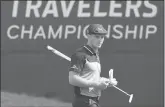  ?? JOHN WOIKE/HARTFORD COURANT ?? Bryson DeChambeau checks his scorecard on the ninth green after a birdie putt during the second round of the Travelers Championsh­ip last summer at TPC River Highlands in Cromwell, Conn.