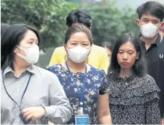  ??  ?? City residents don face masks as PM2.5 levels go through the roof yesterday, putting Bangkok on par with Beijing and Mumbai in terms of hazardous-forhealth air quality.