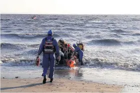  ??  ?? Burnham Coastguard assist with the rescue of three people and a dog from the rocks at Brean Down