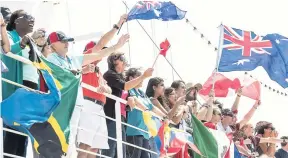  ??  ?? GBA Ships e.VCrewmembe­rs wave their flags during the arrival of the ship in Willemstad, Curaçao.