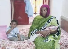  ?? A L FA J E R / T H E ASS O C I AT E D P R E SS ?? This photo of Meriam Ibrahim, with son Martin and baby girl Maya, was taken shortly after Maya’s birth six months ago.