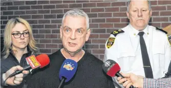  ?? JOE GIBBONS/THE TELEGRAM ?? From left, City of St. John’s deputy city manager of public works Lynnann Winsor, St. John’s Mayor Danny Breen and St. John’s Regional Fire Department Deputy Fire Chief of Operations Rick Mackey speak with reporters Wednesday at the City Depot administra­tive offices on Blackler Avenue.