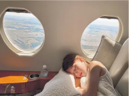  ?? PROVIDED ?? Meghen Leckey’s daughter, Vivienne, takes a nap on the family’s private jet. The Leckey family purchased the plane four weeks ago to avoid flying on commercial planes during the pandemic.