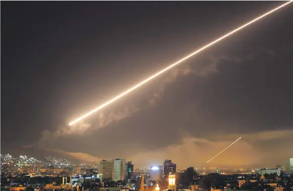  ?? AP ?? Missiles slice through the Damascus skies early yesterday, in retaliatio­n for the Assad regime’s use of chemical weapons