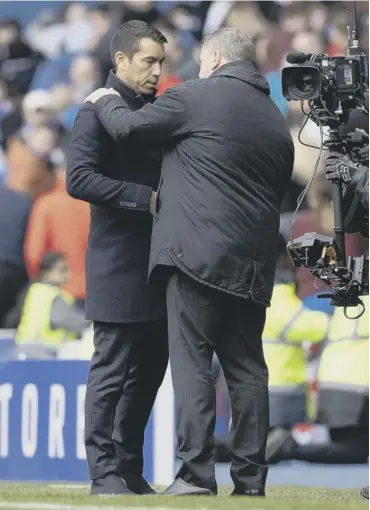  ?? ?? Ange Postecoglo­u greets Rangers manager Giovanni van Bronckhors­t before their last clash