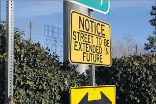  ?? Signal file
photo ?? A sign is displayed on Dockweiler Avenue in Newhall. City Council is set to review plans for a street extension.