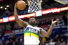  ?? PHOTO/MATTHEW HINTON
AP FILE ?? In this Feb. 13 file photo, New Orleans Pelicans forward Zion Williamson grabs a rebound during the first half of an NBA basketball game against the Oklahoma City Thunder in New Orleans.