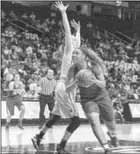  ?? Special to The Sentinel-Record/Alan Jamison ?? CAREER NIGHT: Arkansas forward Kiara Williams (10) drives past Vanderbilt’s Erin Whalen in an SEC Tournament game Wednesday in Nashville, Tenn. Williams had a career-high 25 points as she led the Razorbacks to an 88-76 win over the Commodores.