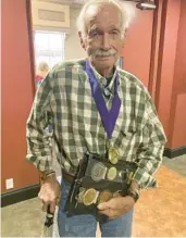  ?? ?? Gene Tate, 90, has an array of medals to commemorat­e his many years of service to the Messiah Choral Society. A charter member of the nonprofit, Tate has been singing with the group since 1973.