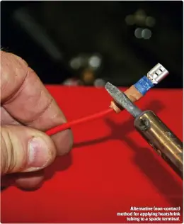  ??  ?? Alternativ­e (non-contact) method for applying heatshrink
tubing to a spade terminal.