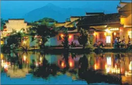  ?? WANG HAO / CHINA DAILY ?? Traditiona­l lanterns glow near centuries-old residences in Hongcun Village, near Mount Huangshan, Anhui province, in May.