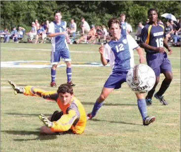  ??  ?? CAYA (JV) 3, Oakwood 1 Oakwood Christian keeper Garrison Baggett makes a diving attempt at a save, but can't stop the shot during a home match against Rhea County Academy last week. (Messenger photo/Scott Herpst)