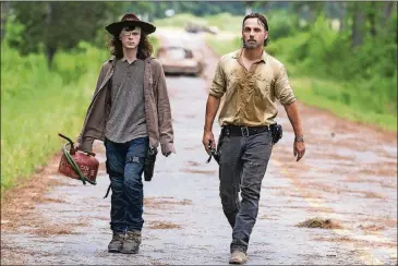  ?? BY GENE PAGE/AMC CONTRIBUTE­D ?? Andrew Lincoln plays Rick Grimes and Chandler Riggs plays Carl Grimes on “The Walking Dead.” Sunday’s episode picked up from where the midseason finale left off, with Carl revealing that he had been bitten by a zombie.