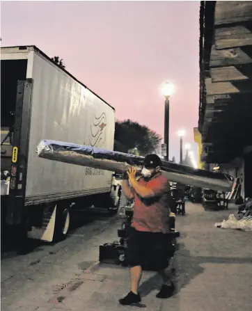  ?? Leah Millis / The Chronicle ?? Workers move historic relics from the Sonoma Barracks. California State Parks decided to move the items from the Barracks and Mission San Francisco Solano as a precaution.