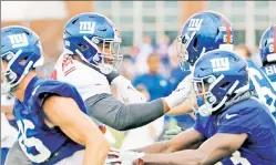  ?? N.Y. Post: Charles Wenzelberg ?? GETTING BETTER: First-round rookie Dexter Lawrence (left) hasn’t made much of an impact in the preseason, but coach Pat Shurmur said the defensive lineman has improved.