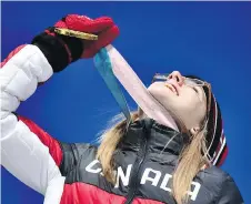  ?? FABRICE COFFRINI/AFP/GETTY IMAGES ?? “It’s a pretty crazy feeling”: Gold-medallist Cassie Sharpe owns the halfpipe podium.