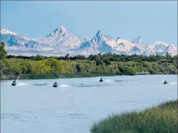  ?? Photograph­s by Brian van der Brug Los Angeles Times ?? PEOPLE RIDE Jet Skis on the Colorado River last month in Needles, a California city of 5,000 that could lose its only water lifeline. “We are incredibly vulnerable. We are talking about life and death,” an official said.