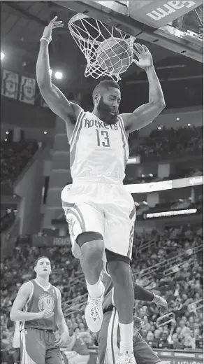  ?? DAVID J. PHILLIP/ASSOCIATED PRESS ?? Houston Rockets’ James Harden dunks against the Golden State Warriors during the fourth quarter of their game on Friday in Houston. The Rockets won 105-83.