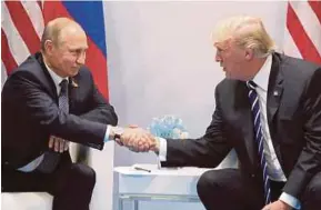  ?? EPA PIC ?? Russian President Vladimir Putin and US President Donald Trump at a meeting on the sidelines of the G20 summit in Hamburg, Germany, recently.