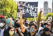  ?? JOHN MINCHILLO AP ?? Protesters against police brutality chant during a rally at Cadman Plaza Park in New York on June 4.