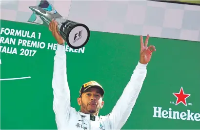  ?? Picture: AFP ?? British driver Lewis Hamilton celebrates on the podium after winning the Italian Formula One Grand Prix at the Autodromo Nazionale circuit in Monza yesterday.