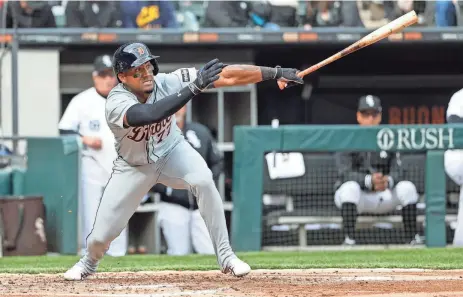  ?? KAMIL KRZACZYNSK­I/USA TODAY ?? Detroit Tigers second baseman Andy Ibanez hits an RBI sacrifice fly during the third inning of the Opening Day game against the Chicago White Sox at Guaranteed Rate Field on Thursday in Chicago.