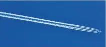  ??  ?? Contrails (short for ‘‘condensati­on trails’’) are lineshaped clouds produced by aircraft engine exhausts or changes in air pressure, typically at aircraft cruise altitudes several miles above Earth’s surface. They are composed primarily of water, in the form of ice crystals.