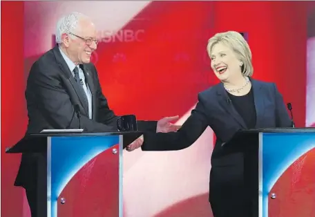  ?? Justin Sullivan Getty I mages ?? BERNIE SANDERS and Hillary Clinton share a friendly moment in Durham, N. H. Their rancorous debate may signal things to come.
