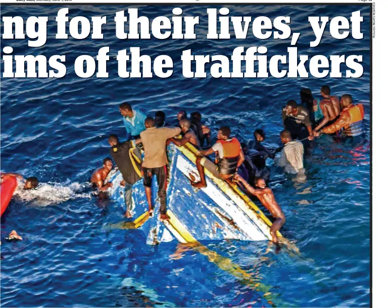  ??  ?? At the mercy of the sea: Migrants cling to the prow of the sinking fishing boat in which they were being trafficked across the Mediterran­ean, while others rapidly fill a life raft