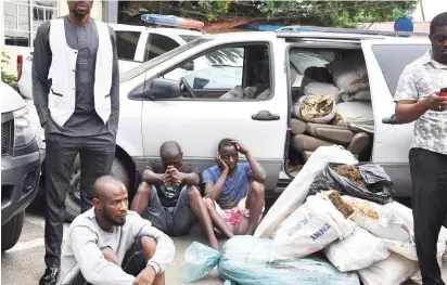  ??  ?? Suspects with exhibits alleged recovered from them, during their parade at the Lagos State Police Command in Ikeja, Lagos yesterday.