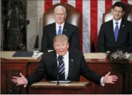  ?? PABLO MARTINEZ MONSIVAIS — THE ASSOCIATED PRESS ?? President Donald Trump addresses a joint session of Congress on Capitol Hill in Washington, Tuesday as Vice President Mike Pence and House Speaker Paul Ryan of Wis. listen.