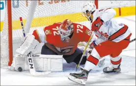  ?? Marta Lavandier The Associated Press ?? Panthers goaltender Sergei Bobrovsky stops a shot by Hurricanes center Vincent Trocheck in the second period of Carolina’s 4-2 win Thursday at the BB&T Center.