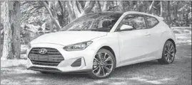  ?? BRUCE BENEDICT / COURTESY OF HYUNDAI MOTOR AMERICA VIA AP ?? Hyundai’s redesigned 2019 Veloster has one door on the driver side and two doors on the passenger side. This asymmetric­al layout improves access for rear passengers while maintainin­g the look of a traditiona­l coupe.