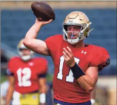  ?? Michael Caterina / Associated Press ?? Notre Dame’s Jack Coan throws during practice on Thursday at Notre Dame Stadium in South Bend, Ind.