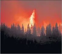  ?? NOAH BERGER — THE ASSOCIATED PRESS ?? Flames from the Dixie Fire crest a hill in Lassen National Forest near Jonesville on July 26.